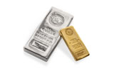 1 kg Gold Bar next to a 100 ozt silver bar