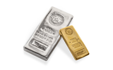 100 troy ounces silver bar next to a kilo gold bar